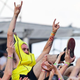 We couldn’t find a photo of a snake at a festival, so here’s a concertgoer dressed as “the snake of fruit:” a banana.